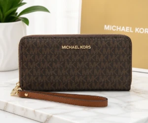 Jet Set Travel Large Logo Continental Wristlet for $55 at Michael Kors, 65% Off